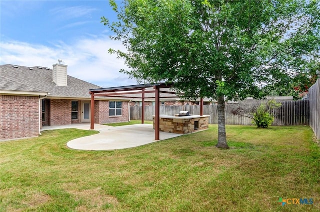 1617 Shadow Canyon Dr, Temple, TX 76502 - fenced backyard with a patio area, an outdoor kitchen, and a pergola