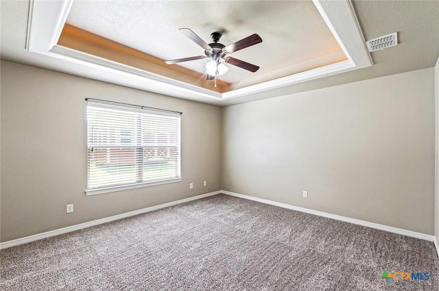 1617 Shadow Canyon Dr, Temple, TX 76502 - spare room with a tray ceiling, ceiling fan, and carpet flooring