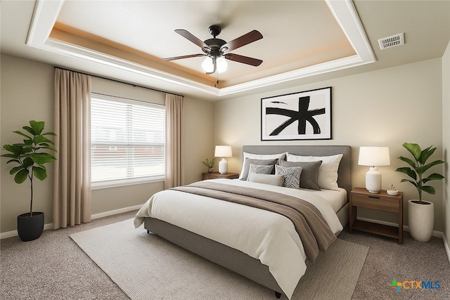 1617 Shadow Canyon Dr, Temple, TX 76502 - carpeted bedroom with a tray ceiling and a ceiling fan