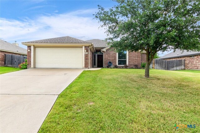 1617 Shadow Canyon Dr, Temple, TX 76502 - ranch-style house featuring a garage, driveway, and brick siding