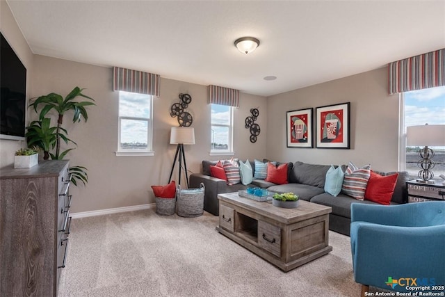 living room featuring carpet floors and a healthy amount of sunlight