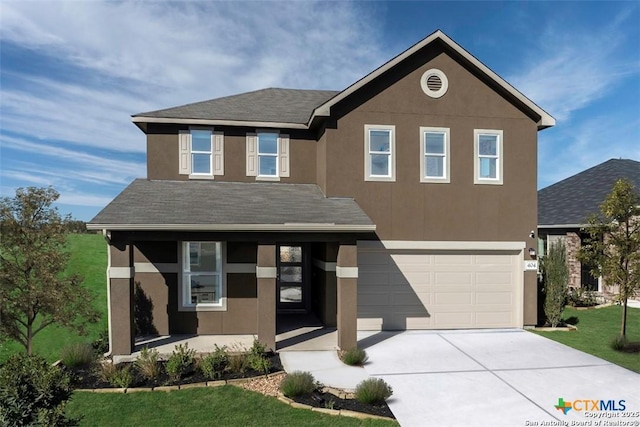 view of front facade featuring a garage and a front yard