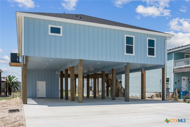 back of house with a carport