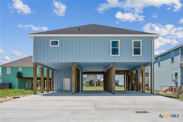 back of property featuring a carport