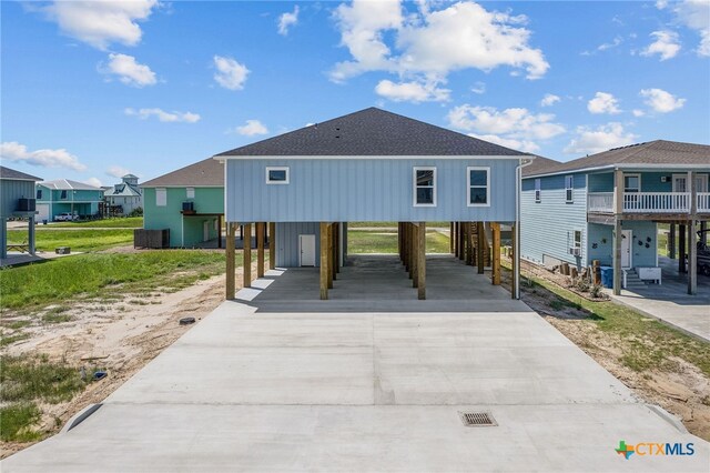 coastal inspired home featuring a carport