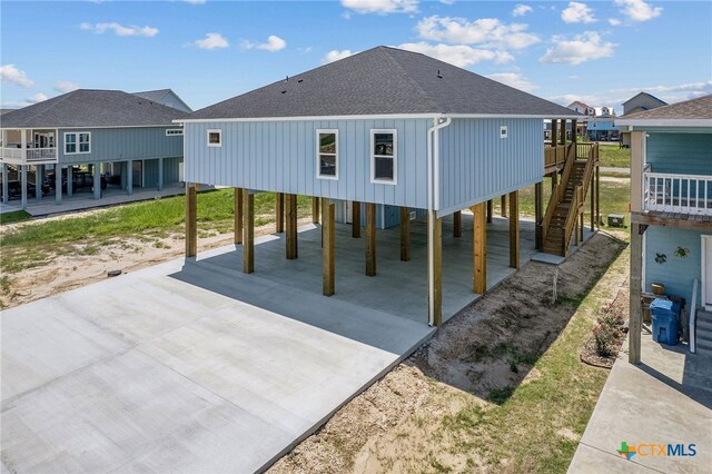 rear view of house with a carport