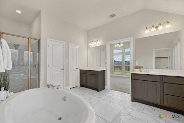 bathroom featuring vanity, lofted ceiling, ceiling fan, and separate shower and tub