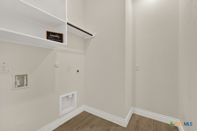 laundry area with gas dryer hookup, electric dryer hookup, hardwood / wood-style floors, and washer hookup