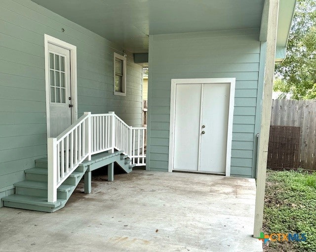 entrance to property with a patio area