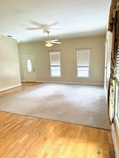 entryway featuring ceiling fan and light hardwood / wood-style flooring