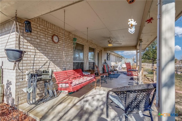 view of patio / terrace featuring ceiling fan and an outdoor living space