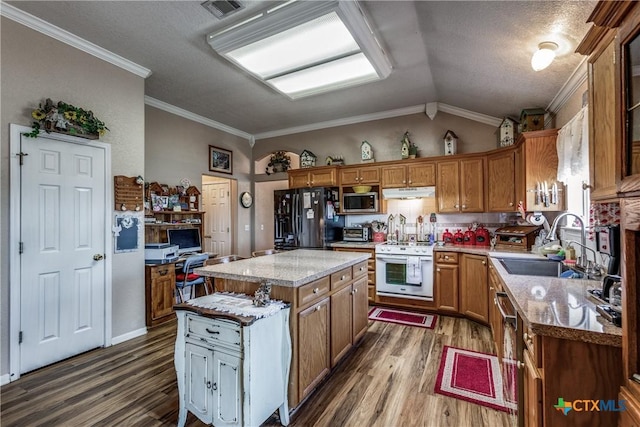 kitchen featuring lofted ceiling, black fridge with ice dispenser, sink, white stove, and a kitchen island