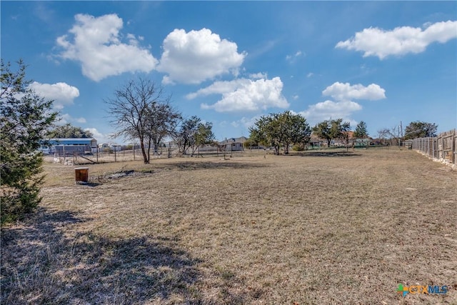 view of yard with a rural view