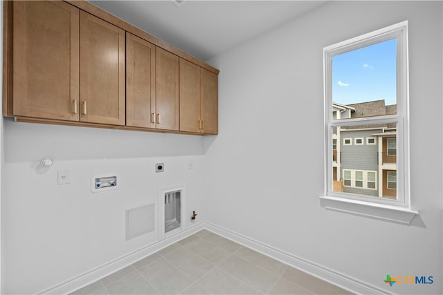 washroom featuring cabinets, washer hookup, hookup for a gas dryer, and electric dryer hookup