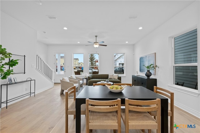 dining space featuring ceiling fan and light hardwood / wood-style floors