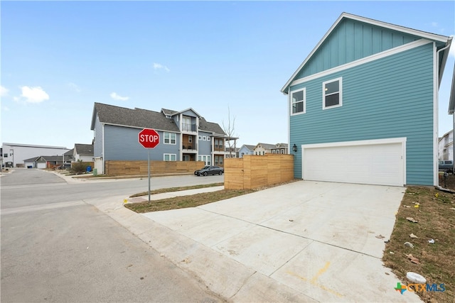 view of side of home with a garage