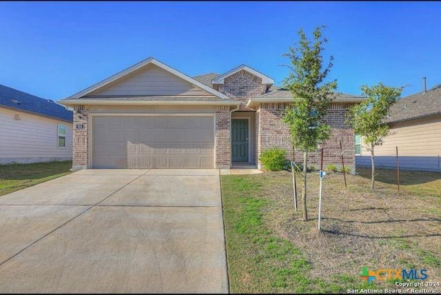 ranch-style home featuring a garage and a front yard