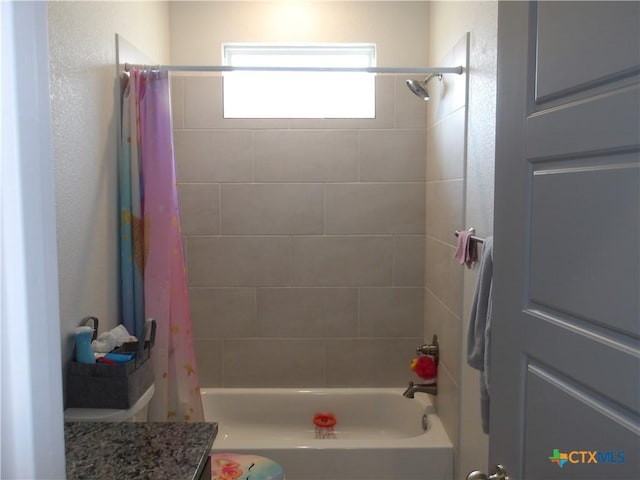 full bath featuring shower / bath combo with shower curtain