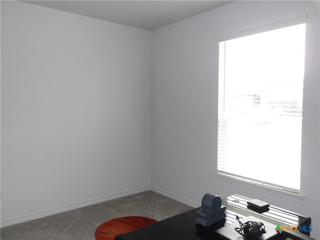 interior space featuring baseboards