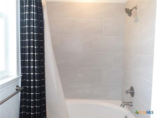 bathroom featuring shower / tub combo with curtain
