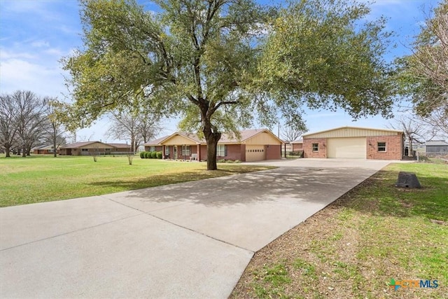 single story home featuring brick siding, a front yard, and a garage