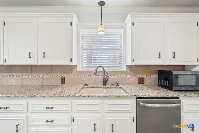 kitchen with white cabinets, appliances with stainless steel finishes, and a sink