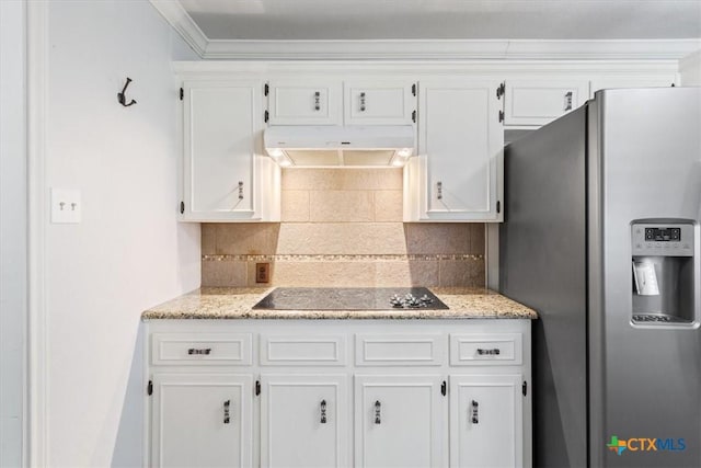 kitchen featuring stainless steel fridge with ice dispenser, decorative backsplash, under cabinet range hood, white cabinetry, and black electric cooktop