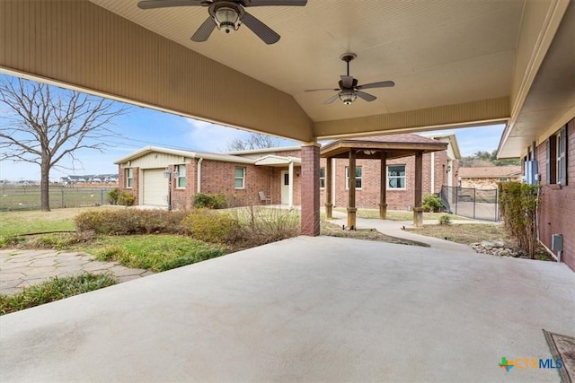 view of patio / terrace with a gazebo, ceiling fan, and fence