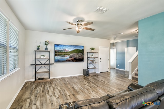 living room with ceiling fan and wood-type flooring