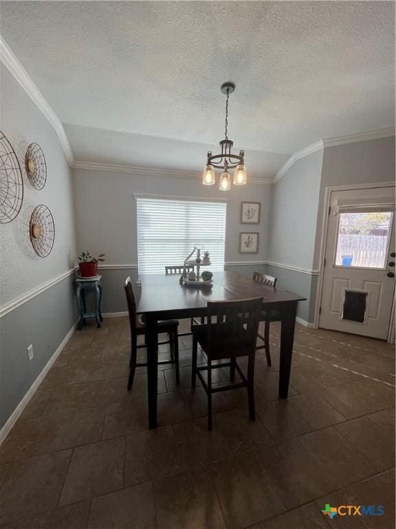 dining space with an inviting chandelier, crown molding, and vaulted ceiling