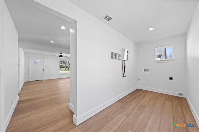 laundry room with hookup for a gas dryer, hookup for a washing machine, light hardwood / wood-style floors, and hookup for an electric dryer