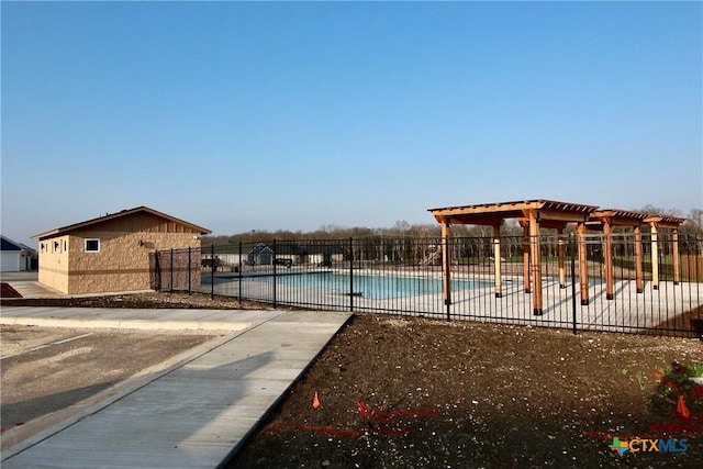 view of swimming pool with a pergola and a patio