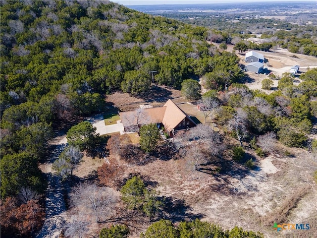 bird's eye view featuring a view of trees