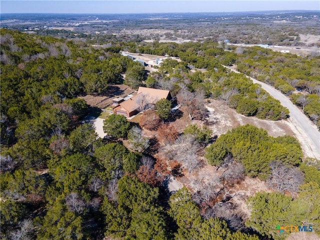 drone / aerial view with a view of trees