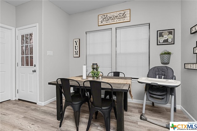 dining space featuring hardwood / wood-style flooring