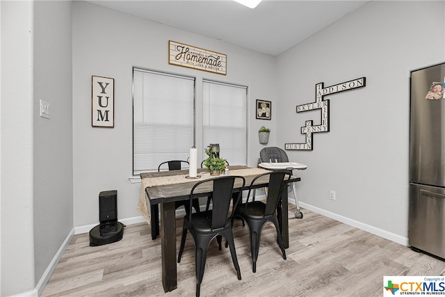 dining area with light hardwood / wood-style floors