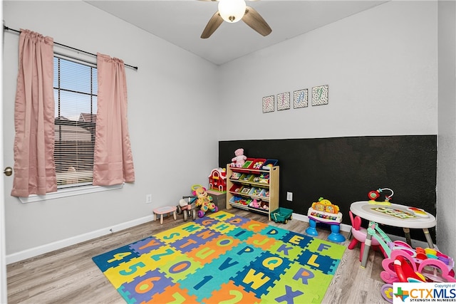 playroom featuring ceiling fan and wood-type flooring