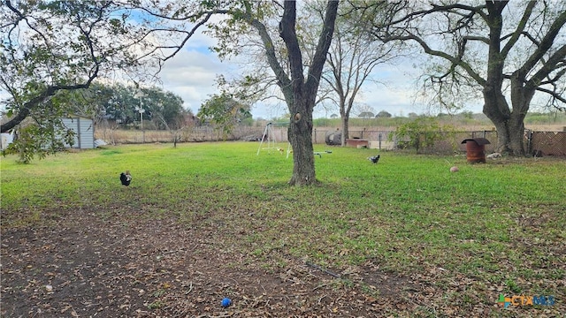 view of yard featuring a storage unit