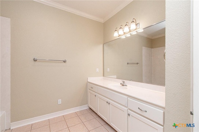 bathroom with crown molding, tile patterned floors, and vanity