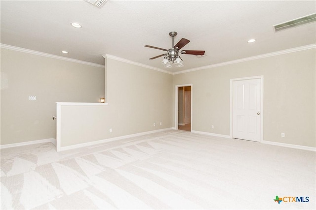 carpeted empty room featuring crown molding and ceiling fan