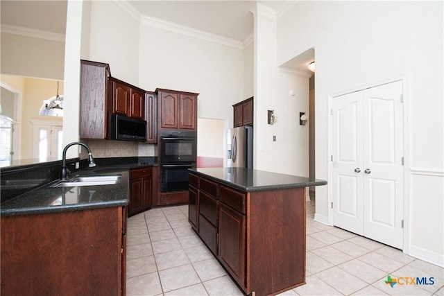 kitchen featuring sink, stainless steel fridge with ice dispenser, ornamental molding, a kitchen island, and black double oven