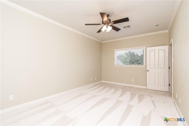 carpeted spare room with crown molding and ceiling fan