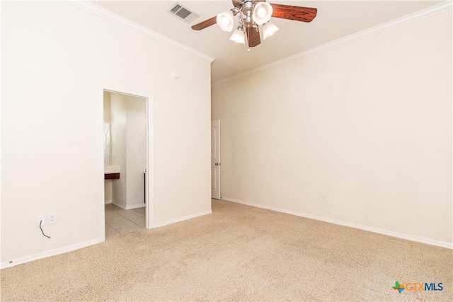 carpeted spare room with ornamental molding and ceiling fan