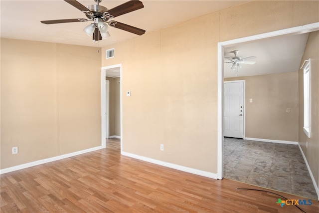 unfurnished room featuring ceiling fan and light hardwood / wood-style flooring