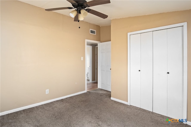 unfurnished bedroom with carpet flooring, ceiling fan, and a closet