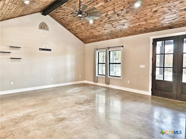 spare room with beamed ceiling, concrete flooring, high vaulted ceiling, and plenty of natural light