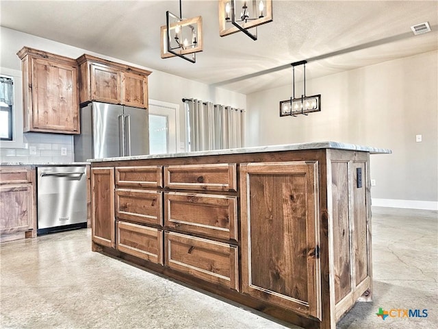 kitchen with decorative light fixtures, an inviting chandelier, and stainless steel appliances