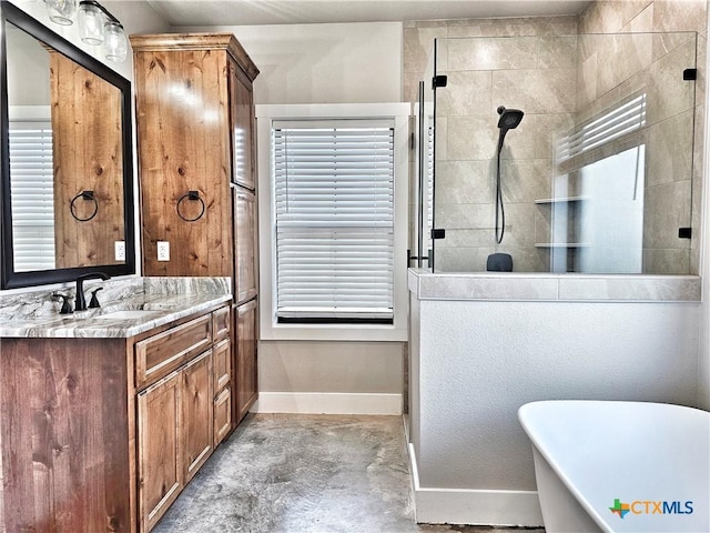 bathroom featuring concrete flooring, a wealth of natural light, vanity, and independent shower and bath