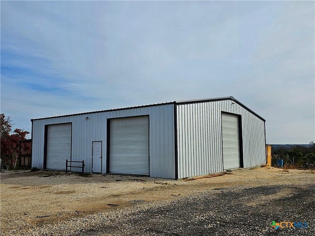 view of outdoor structure with a garage