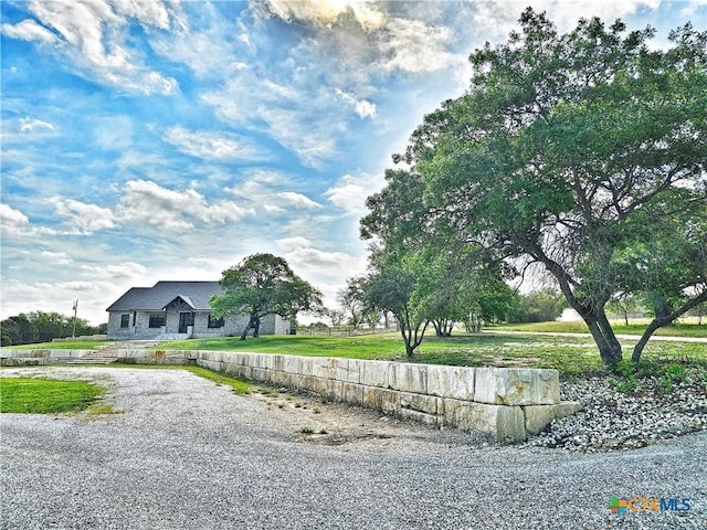 exterior space featuring gravel driveway